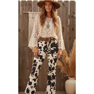 En Saison Anthropologie Cow Print High Waisted Flare Jeans